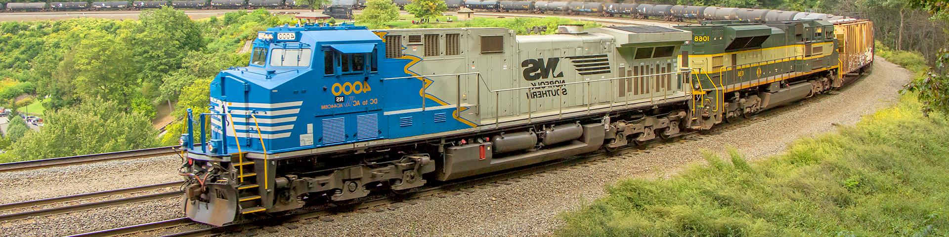 A train engine pulls cars around the Horseshoe Curve in Altoona